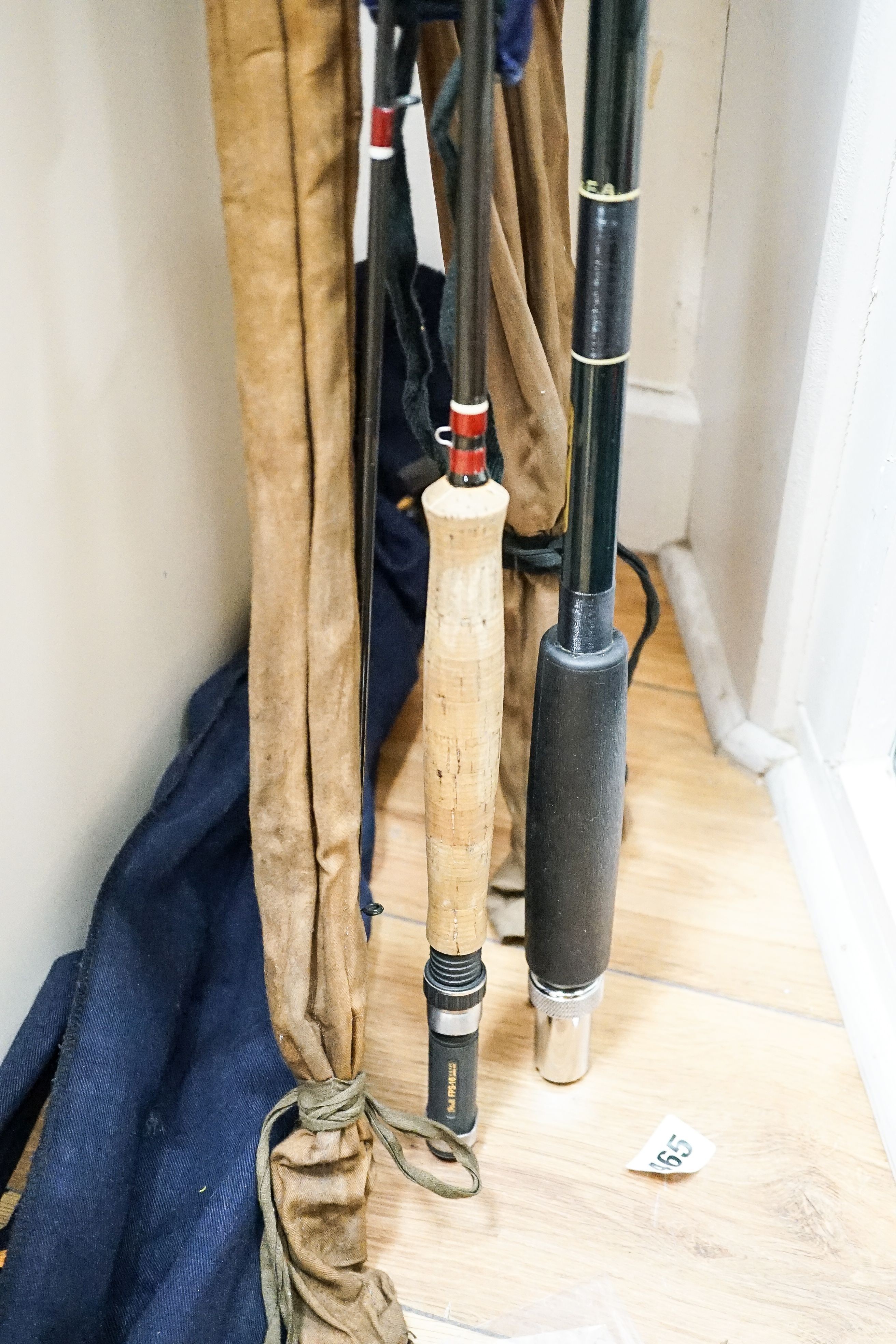 A Sealey octopus cane fishing rod and A Sealey carbon fibre rod, two others, reel and accessories